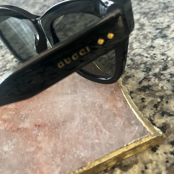 Gucci Women\'s Black Sunglasses with Gold Accents